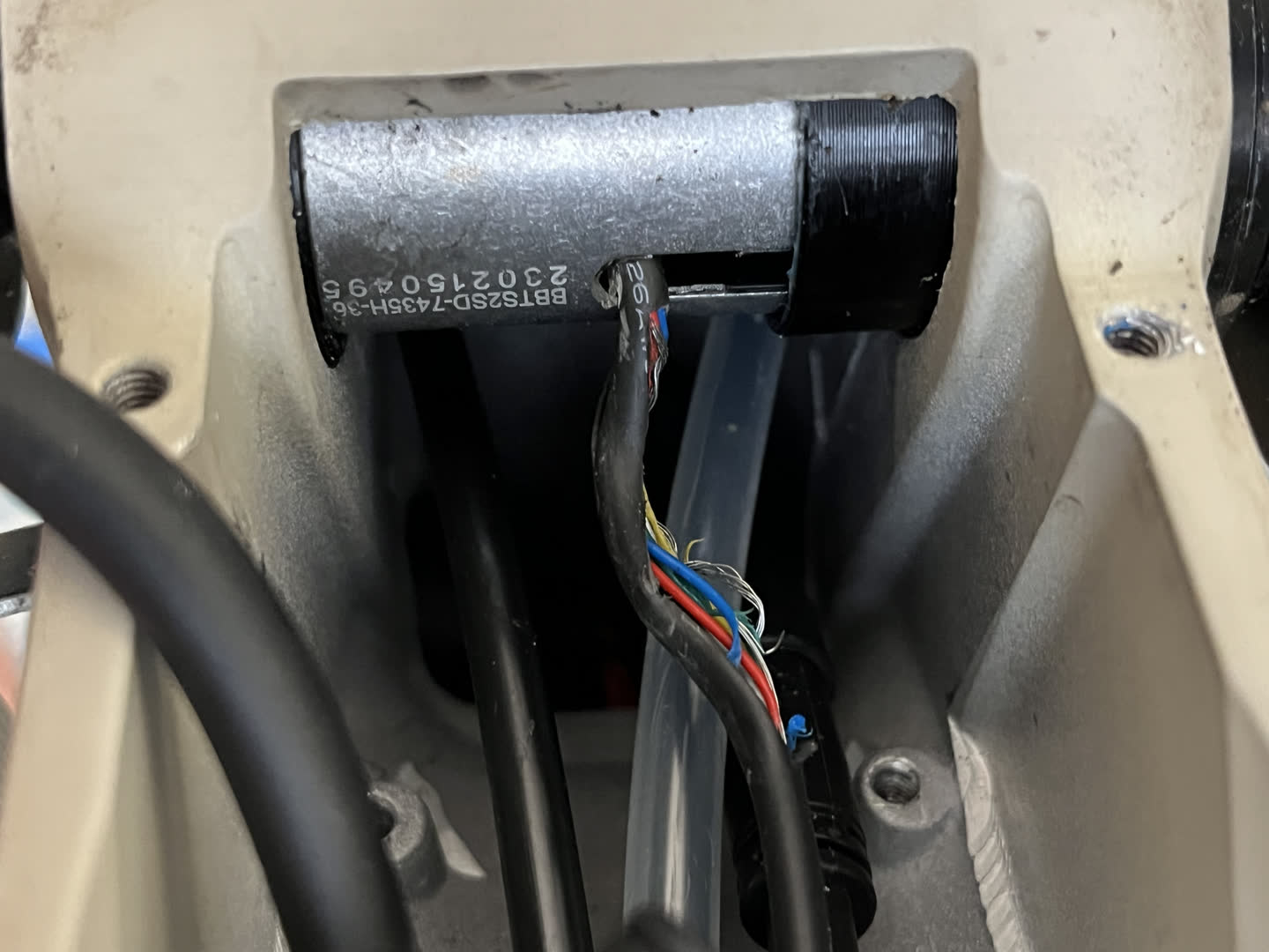 Bottom bracket still installed in the bike with damaged wires shown