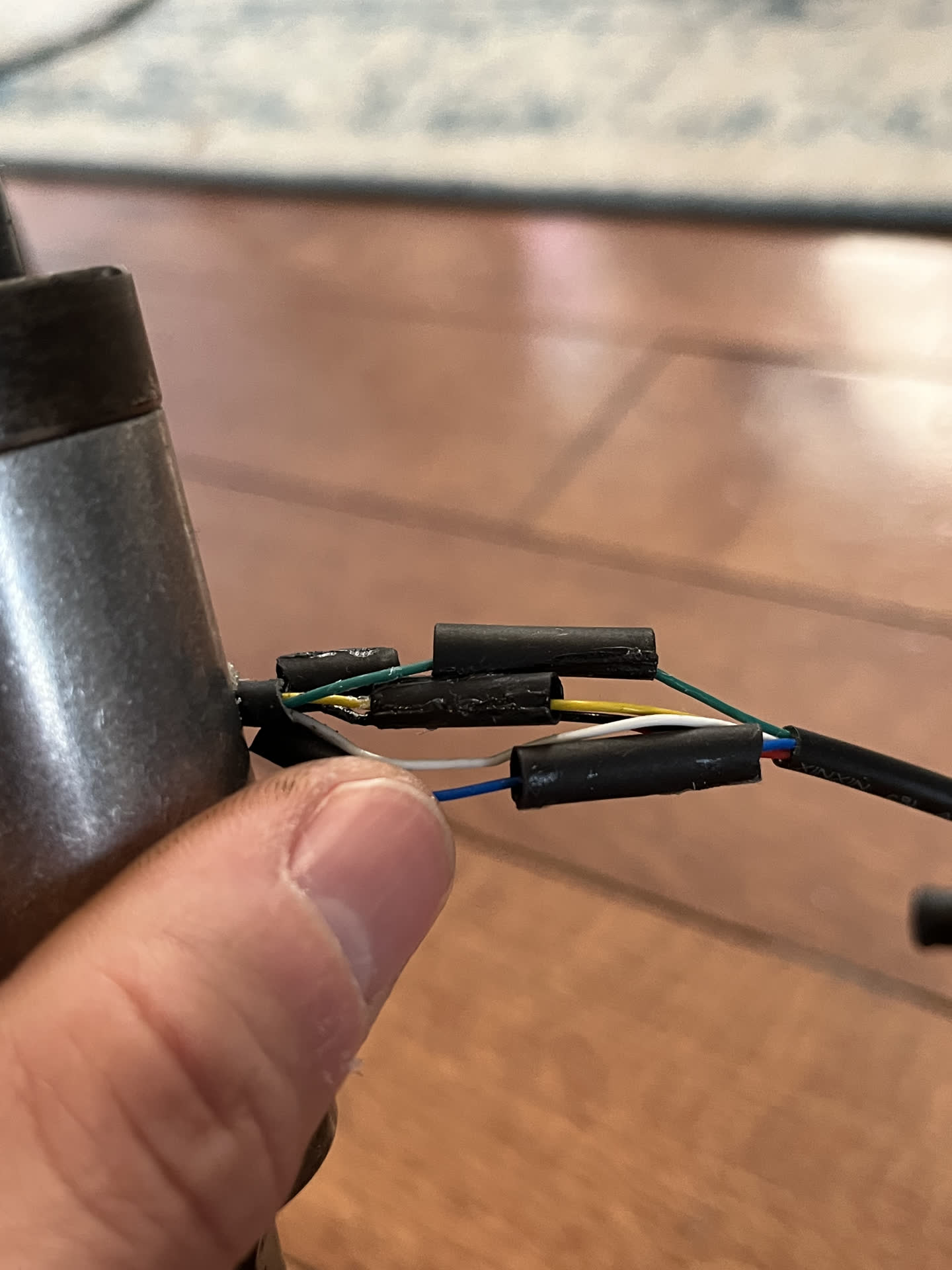 Split heat shrink tubing on wires and super-glued back together