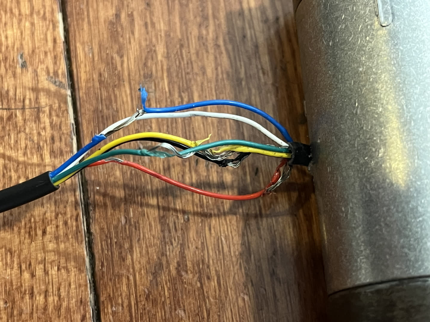 Torque sensor wires spread apart and untangled for the sake of analysis and soldering